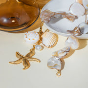 Necklace with shell and starfish charms on a light background